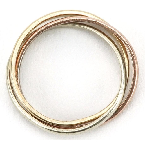 575 - A 9ct three tone gold Russian wedding ring, size K, 3.2g