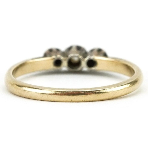 130 - An 18ct gold diamond three stone ring, size L/M, 2.0g.