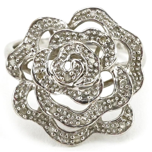 316 - A 9ct white gold diamond floral dress ring, total diamond weight approximately 0.09 carat, size N, 2... 