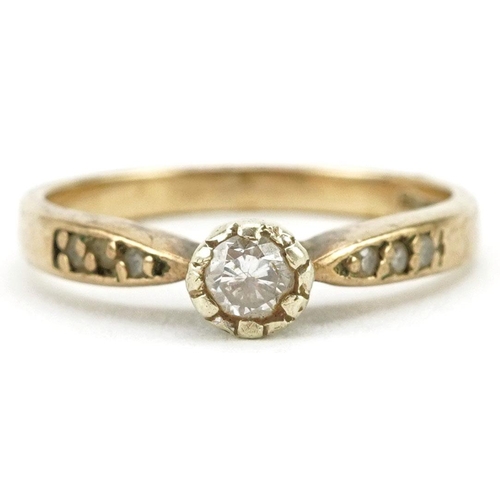 324 - A 9ct gold diamond solitaire ring with diamond set shoulders, size O, 2.6g.