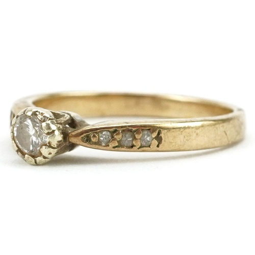 324 - A 9ct gold diamond solitaire ring with diamond set shoulders, size O, 2.6g.