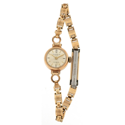 184 - Kienzle, a ladies 9ct gold cased manual wind wristwatch with gold plated strap, 16mm in diameter.