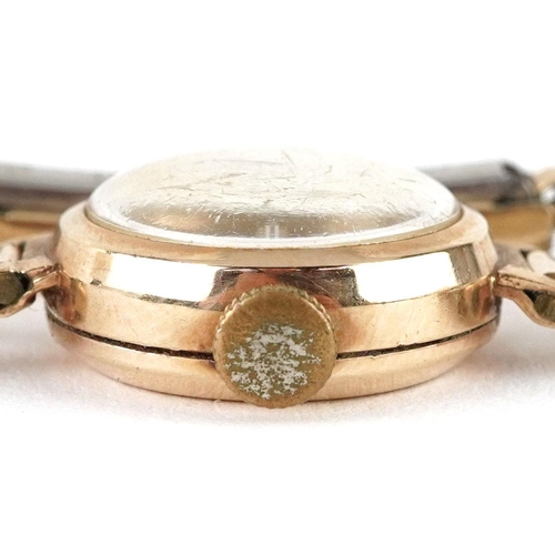 184 - Kienzle, a ladies 9ct gold cased manual wind wristwatch with gold plated strap, 16mm in diameter.