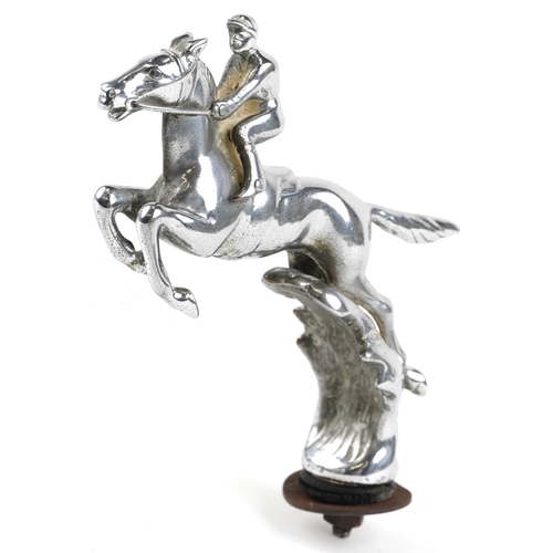 209 - An early 20th century chromium plated car mascot in the form of a jockey on a racehorse, 17cm high.