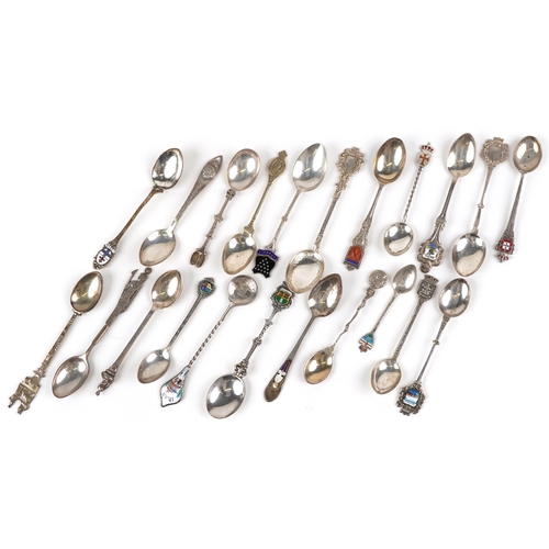 1339 - A small collection of silver and plated spoons with enamelled decoration.