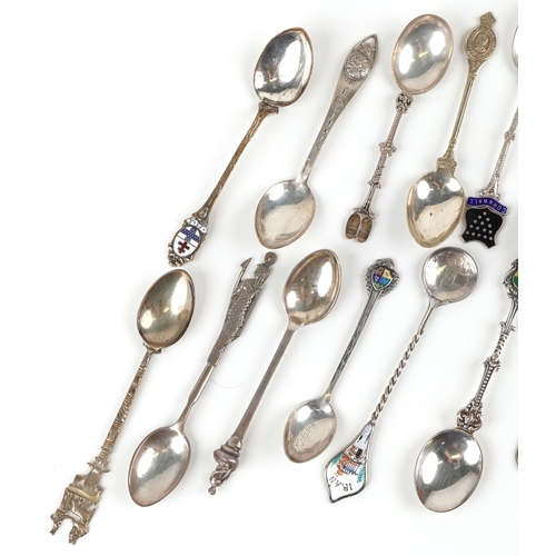 1339 - A small collection of silver and plated spoons with enamelled decoration.