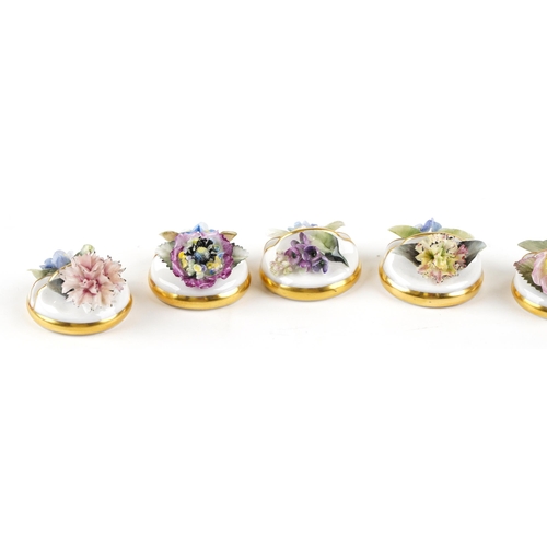 1338 - A set of eight Royal Crown Derby fine bone china menu holders with floral decoration, boxed.