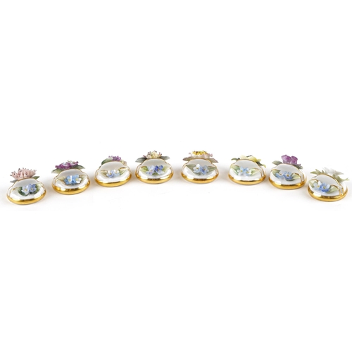 1338 - A set of eight Royal Crown Derby fine bone china menu holders with floral decoration, boxed.