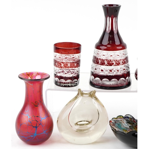 1366 - A mixed group of 20th century glassware to include a Bohemian flash overlaid decanter and cup, a mil... 