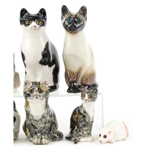 406 - A collection of seven Winstanley studio pottery figures of cats, the largest 21cm high, together wit... 