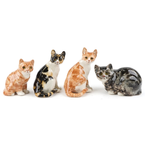 A collection of four Winstanley studio pottery figures of cats, the largest 25cm high.