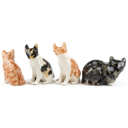 403 - A collection of four Winstanley studio pottery figures of cats, the largest 25cm high.