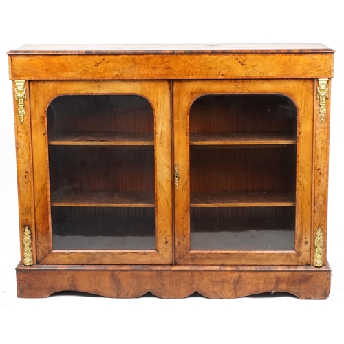 1031 - A mid Victorian figured mahogany and walnut two door pier cabinet with gilt metal mounts, 109cm H x ... 