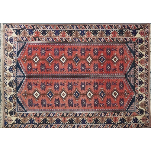 1016 - A Turkish Oushak carpet, mid 20th century, the blue field with two central columns with stylized mot... 