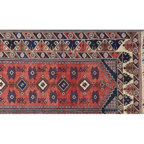 1016 - A Turkish Oushak carpet, mid 20th century, the blue field with two central columns with stylized mot... 