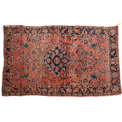 1039 - A Sarouk rug, North West Persia, mid 20th century, the charcoal field with a central stylized medall... 