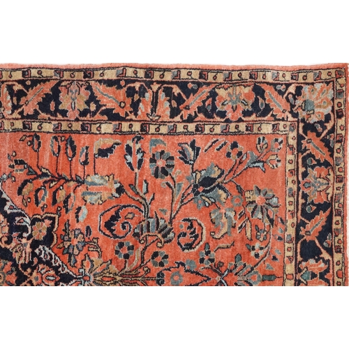 1039 - A Sarouk rug, North West Persia, mid 20th century, the charcoal field with a central stylized medall... 