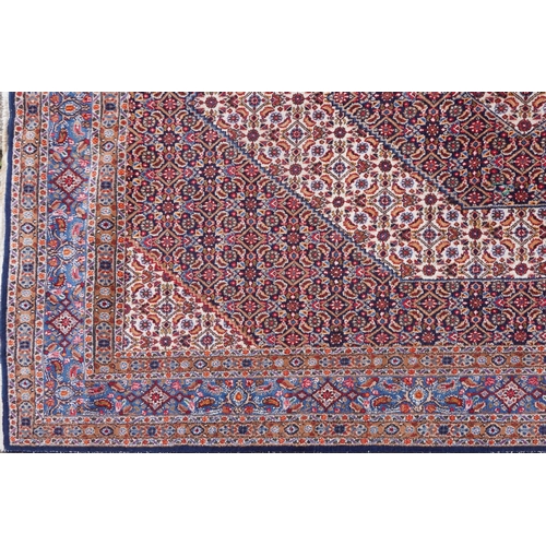 1018 - A Bidjar carpet, North West Persia, mid 20th century, the midnight blue field with a central stylize... 