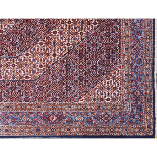 1018 - A Bidjar carpet, North West Persia, mid 20th century, the midnight blue field with a central stylize... 