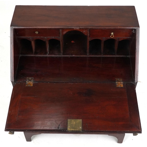 1007 - A small George III figured mahogany bureau, the fall front above four graduated long drawers, 90cm H... 