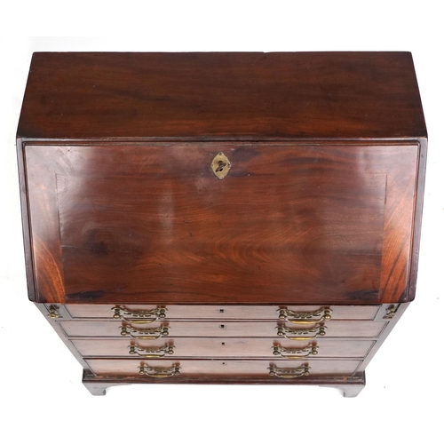 1007 - A small George III figured mahogany bureau, the fall front above four graduated long drawers, 90cm H... 