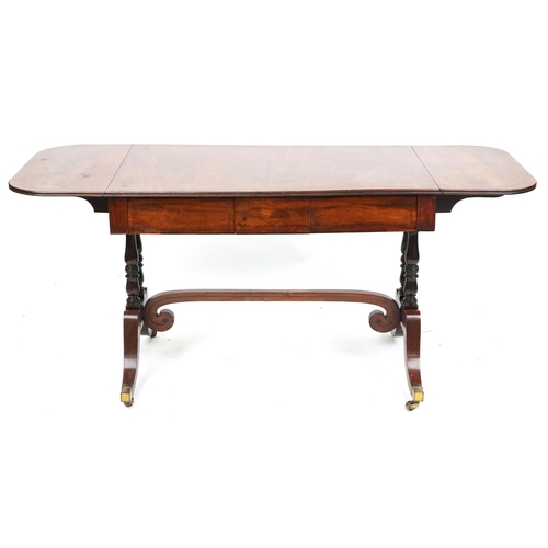 1073 - An early 19th century mahogany sofa table fitted with two frieze drawers raised on sabre legs, 70cm ... 