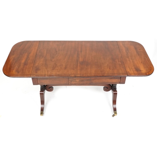 1073 - An early 19th century mahogany sofa table fitted with two frieze drawers raised on sabre legs, 70cm ... 