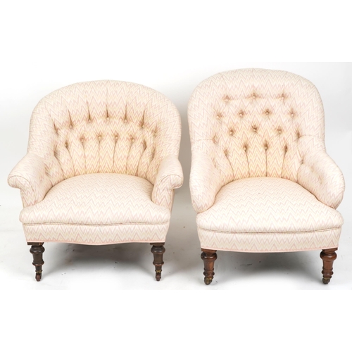 1008 - Two similar Victorian tub back armchairs raised on turned legs and castors,  87cm high x 69cm wide.