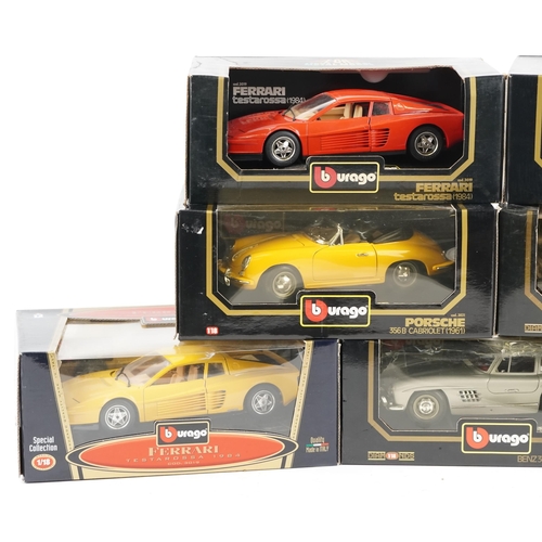 518 - Seven Burago diecast model sports cars including Porsche, Mercedes and Ferrari.