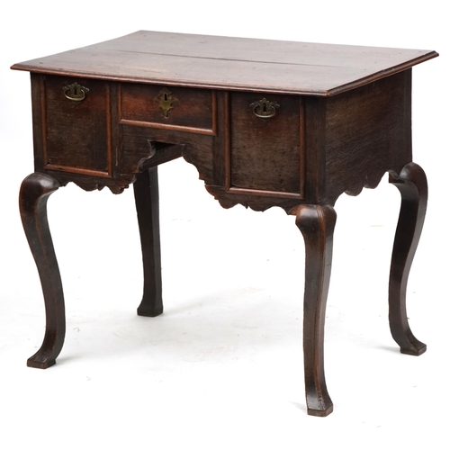 1023 - An 18th century oak lowboy fitted with three drawers, raised on cabriole legs, 72cm H x 82cm W x 56c... 