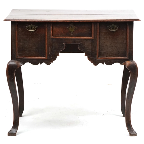 1023 - An 18th century oak lowboy fitted with three drawers, raised on cabriole legs, 72cm H x 82cm W x 56c... 