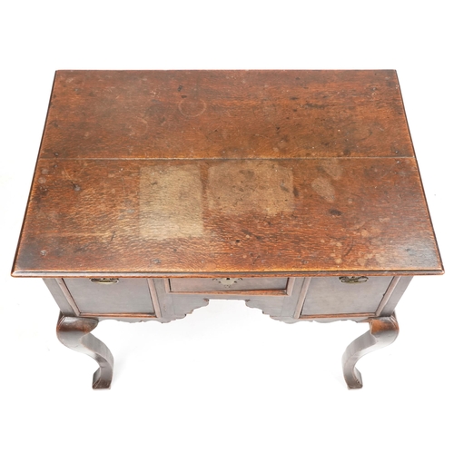 1023 - An 18th century oak lowboy fitted with three drawers, raised on cabriole legs, 72cm H x 82cm W x 56c... 