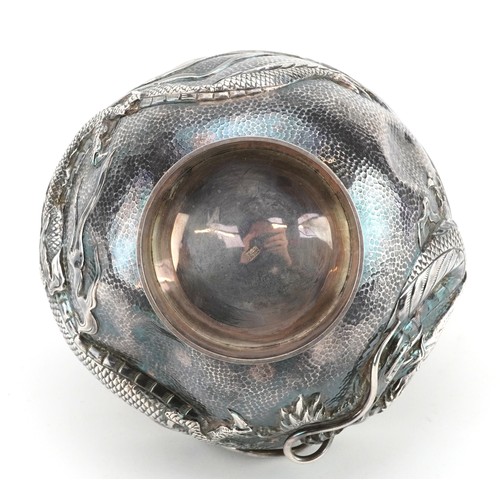 155 - A Japanese silver dragon bowl, late 19th/early 20th century, bearing mark to base, raised on a turne... 