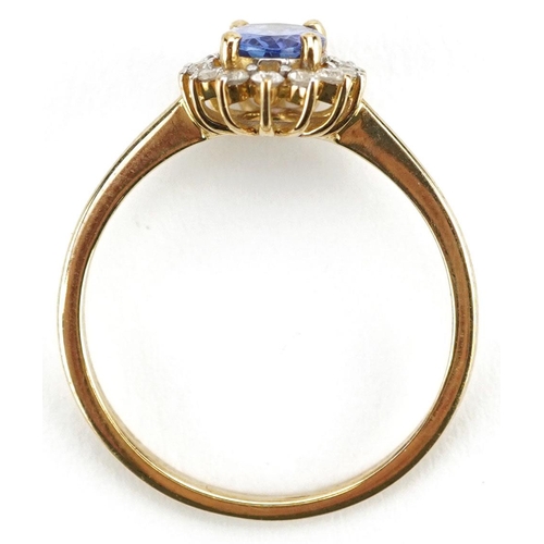  A 9ct gold tanzanite and diamond cluster ring, the tanzanite approximately 7.0mm x 4.95mm x 3.0mm de... 