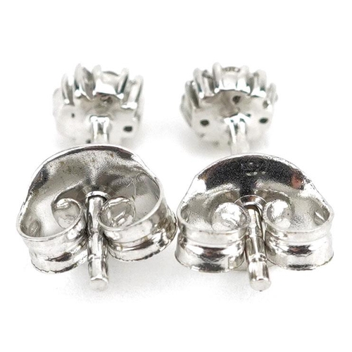 395 - A pair of 9ct white gold diamond cluster stud earrings, 4.4mm in diameter, total 0.8g.