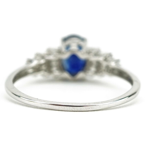  A 9ct white gold sapphire ring with baguette cut diamond stepped shoulders, the sapphire approximate... 