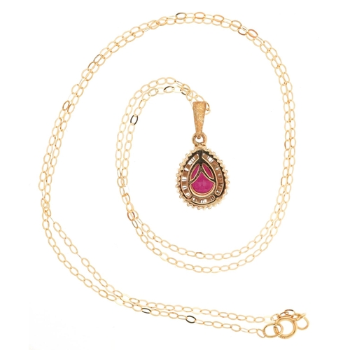  An unmarked gold ruby teardrop pendant set with baguette cut diamonds on a 9ct gold necklace, 1.9cm ... 