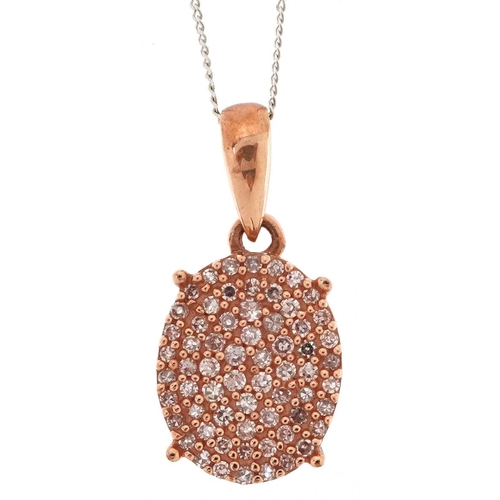 81 - A 9ct rose gold pink diamond cluster pendant on a 9ct white gold necklace, total diamond weight appr... 