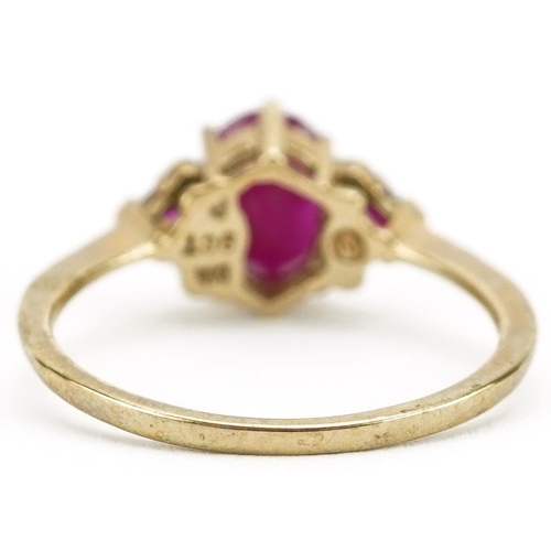 447 - A 9ct gold ruby and diamond cluster ring, size P, 2.0g.