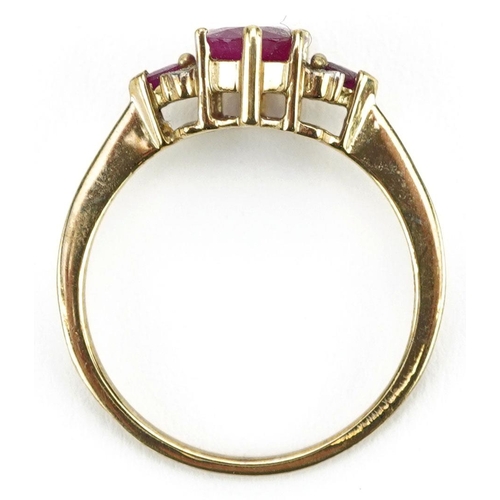 447 - A 9ct gold ruby and diamond cluster ring, size P, 2.0g.