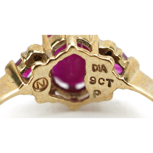 447 - A 9ct gold ruby and diamond cluster ring, size P, 2.0g.