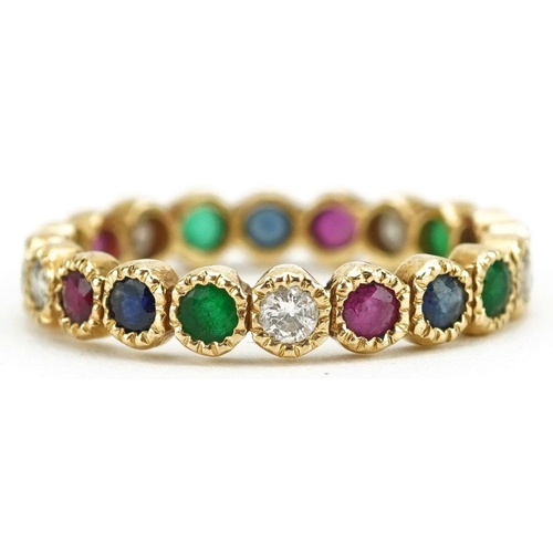  An unmarked gold multi gem eternity ring set with diamonds, rubies, sapphires and emeralds, size Q/R... 