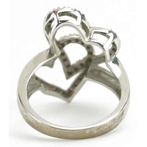 152 - A 9ct white gold diamond double love heart ring, size L, 3.3g.