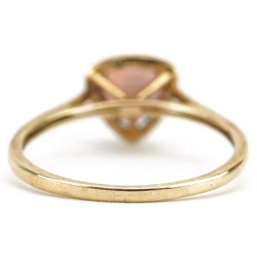 150 - A 9ct gold garnet and diamond ring, size N, 1.4g.