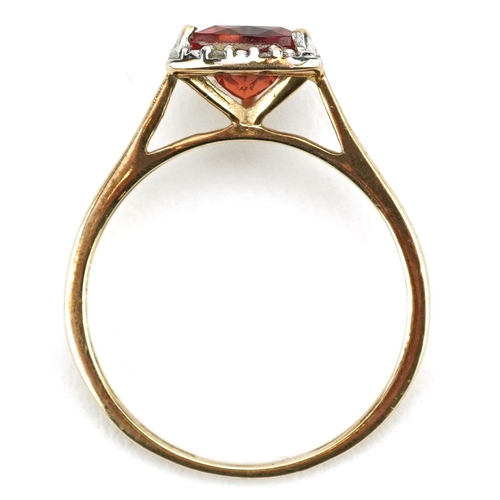 150 - A 9ct gold garnet and diamond ring, size N, 1.4g.