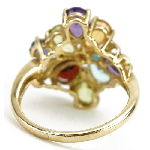 426 - A 9ct gold multi gem dress ring set with colourful stones including garnet, citrine, amethyst and pe... 