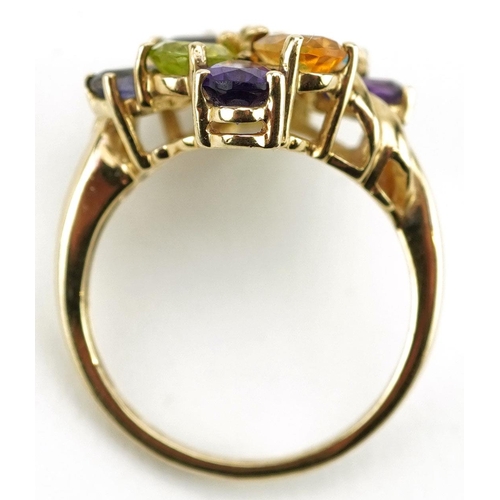 426 - A 9ct gold multi gem dress ring set with colourful stones including garnet, citrine, amethyst and pe... 