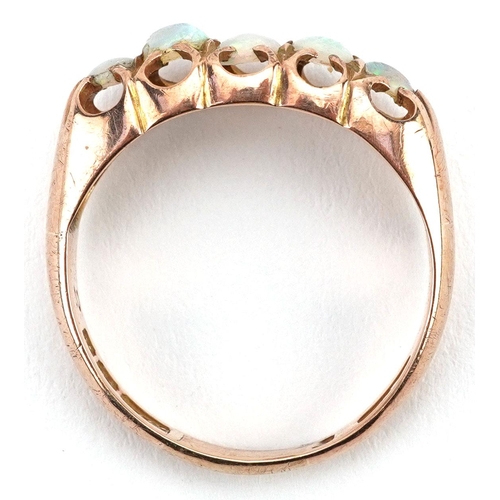 429 - An Edwardian 9ct rose gold cabochon opal five stone ring, Birmingham 1903, size Q, 2.9g.