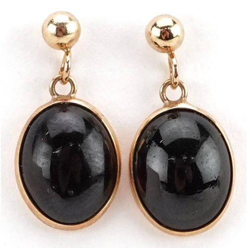 483 - A pair of 9ct gold cabochon garnet drop earrings, 1.7cm high, total 2.4g.