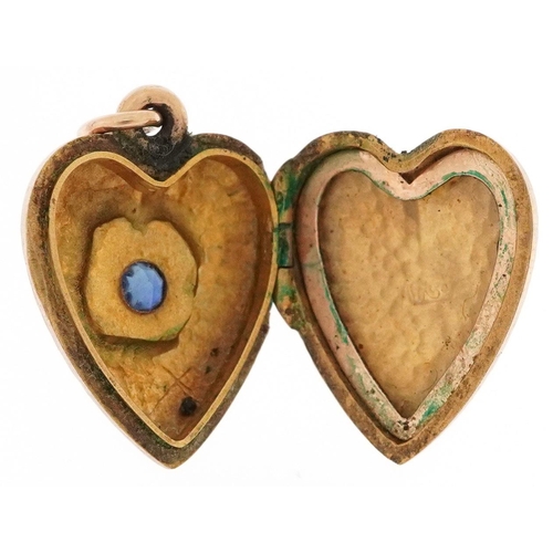 343 - A 9ct gold love heart locket set with a sapphire solitaire, 1.9cm high, 2.9g.